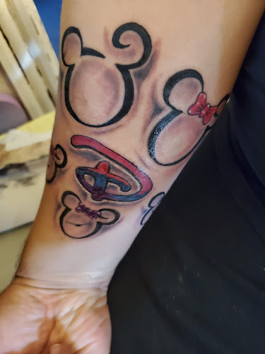 Year Of The Dragon Tattoos tattoo shop in Auburn, New York