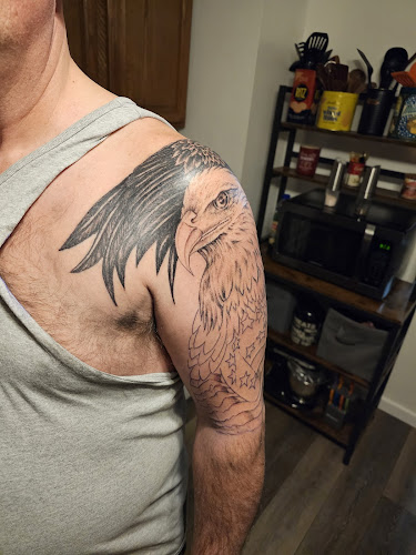 Ēddie's Tattoo And Piercing Studio tattoo shop in Escanaba, Michigan