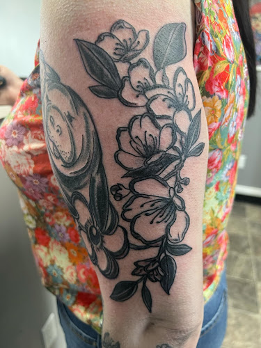 Enchanted Rose Tattoo Parlor tattoo shop in Onsted, Michigan