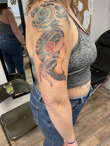 AU Tattoo tattoo shop in Russell, Kansas