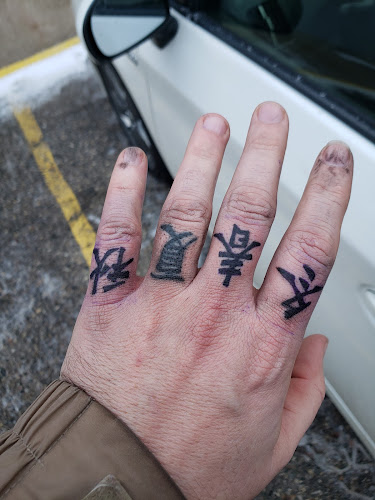 Whole Body Piercing tattoo shop in St. Louis, Michigan