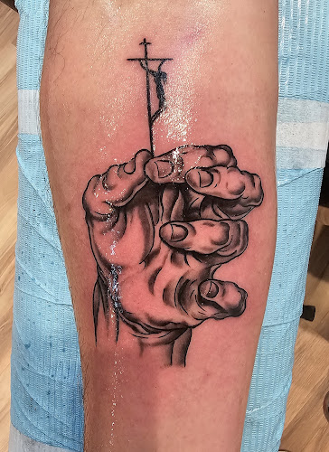 Tommy Houlihan's Miraculous Medal Tattoo tattoo shop in Sunbury, Pennsylvania